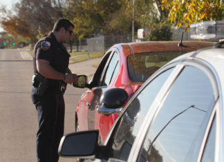 If you are walking down the road and a police officer stops you to ask you for your ID, must you show him?